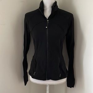 Zip up lululemon black jacket  slight ruffle in back .  size 6